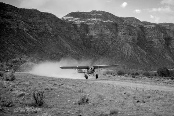 A Cub lifting off a canyon dirt strip
